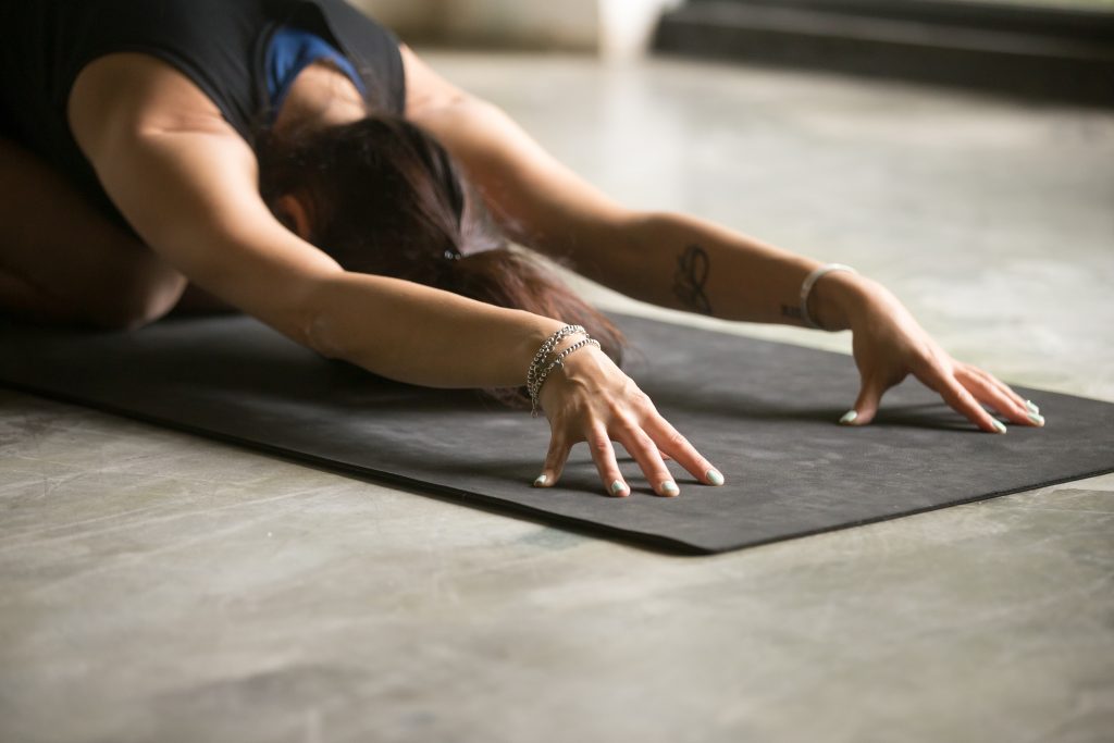 Close up of female hands, Balasana pose